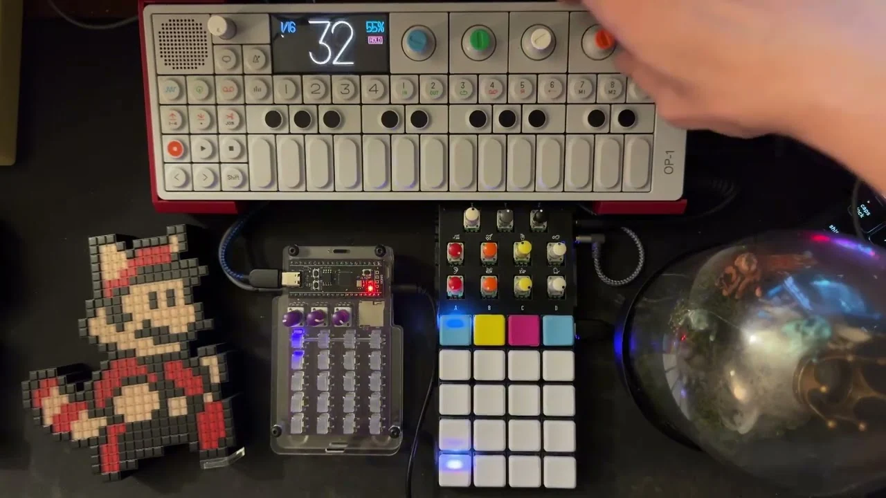 A Zeptomech beta unit in a tabletop music setup with sequencers and controllers