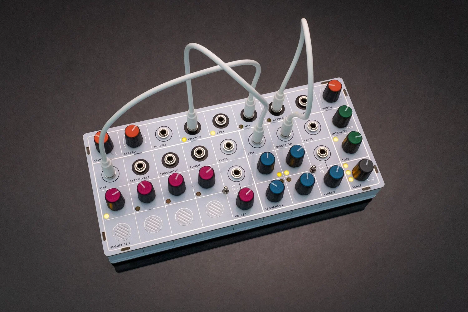 The Modern Sounds Pluto desktop synthesizer with colorful knobs and a circular display