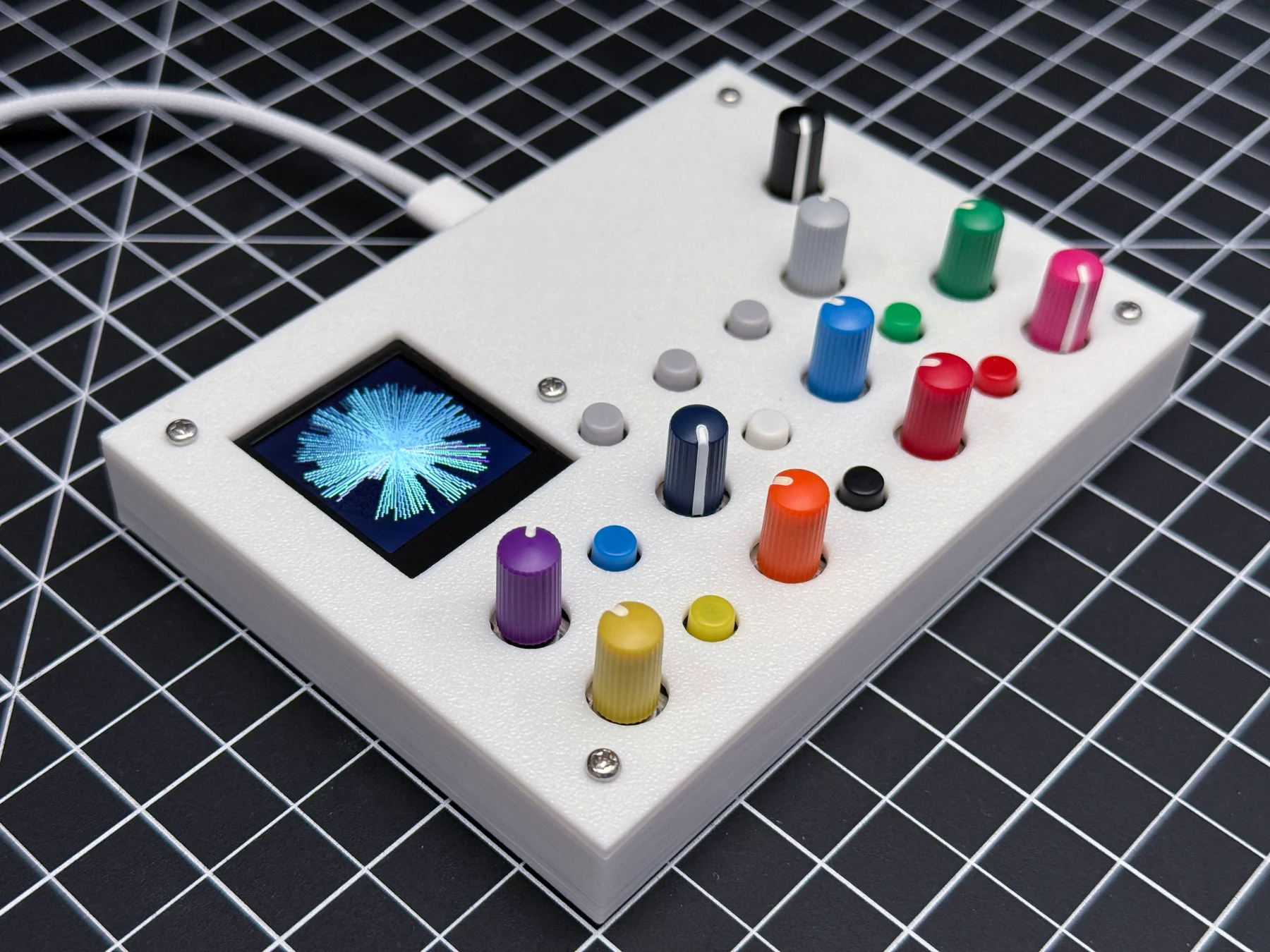 Two colorful purple Prismatic Spray II bytebeat synthesizers outside on patterned tiles