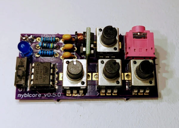 The original Infinite Digits nyblcore circuit board with three knobs, audio jacks, and exposed components