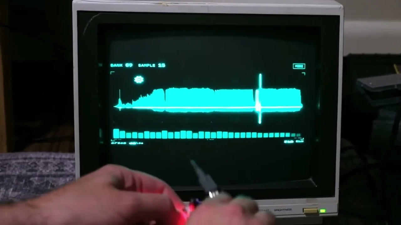 The Zeptocore visualizer glowing cyan on a 1986 Magnavox monochrome CRT connected to a Raspberry Pi