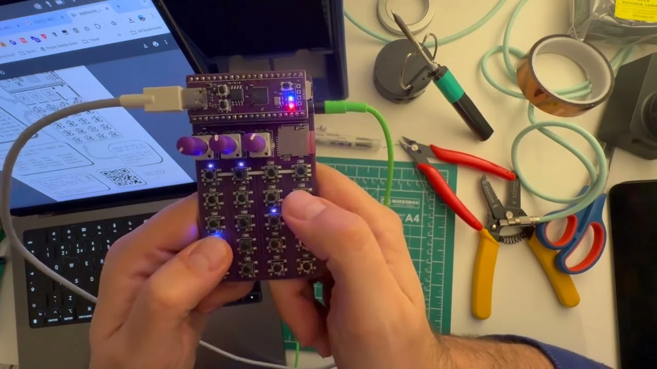 Pilkafa testing a freshly assembled Zeptocore above a workbench